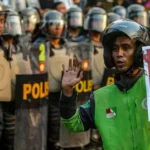 Protes di Indonesia: Warga Asia menggunakan Grab dan Gojek untuk mengirimkan makanan dan bantuan kepada pengemudi pengantar